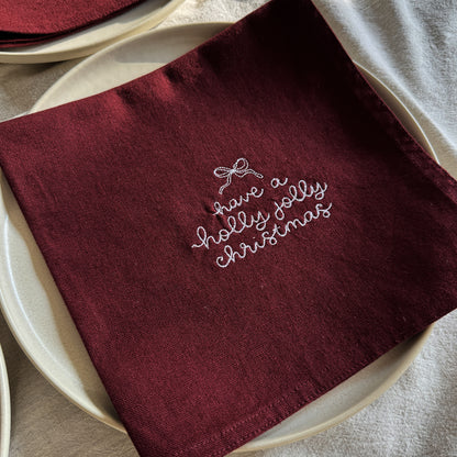 HOLLY JOLLY CHRISTMAS – Besticktes Leinen-Serviettenset, 4er-Set Bordeaux