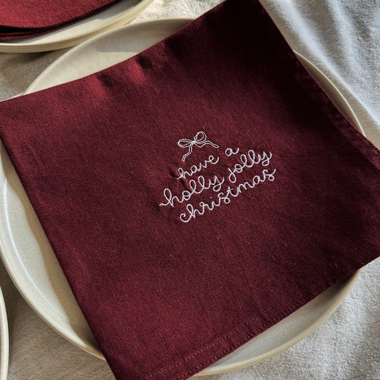 HOLLY JOLLY CHRISTMAS – Besticktes Leinen-Serviettenset, 4er-Set Bordeaux
