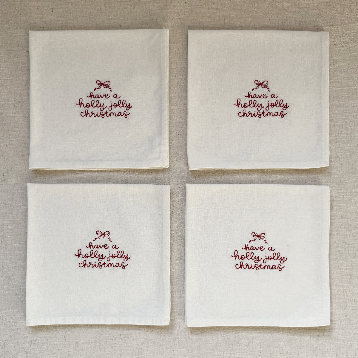 HOLLY JOLLY CHRISTMAS – Besticktes Leinen-Serviettenset, 4er-Set Weiß