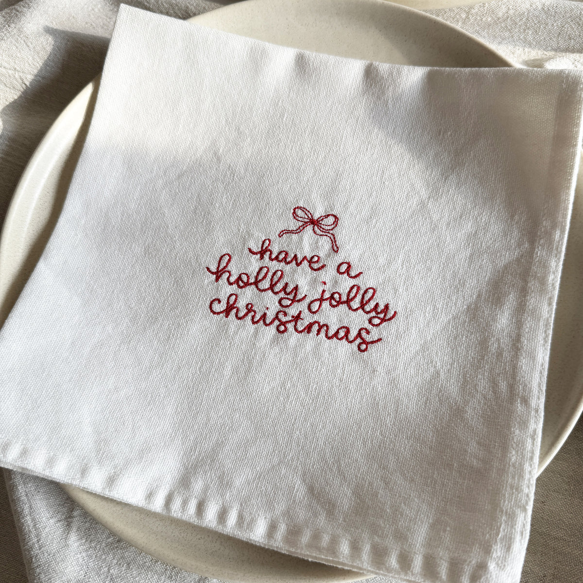 HOLLY JOLLY CHRISTMAS – Besticktes Leinen-Serviettenset, 4er-Set Weiß